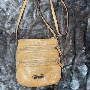 Calvin Klein Crossbody light tan in color